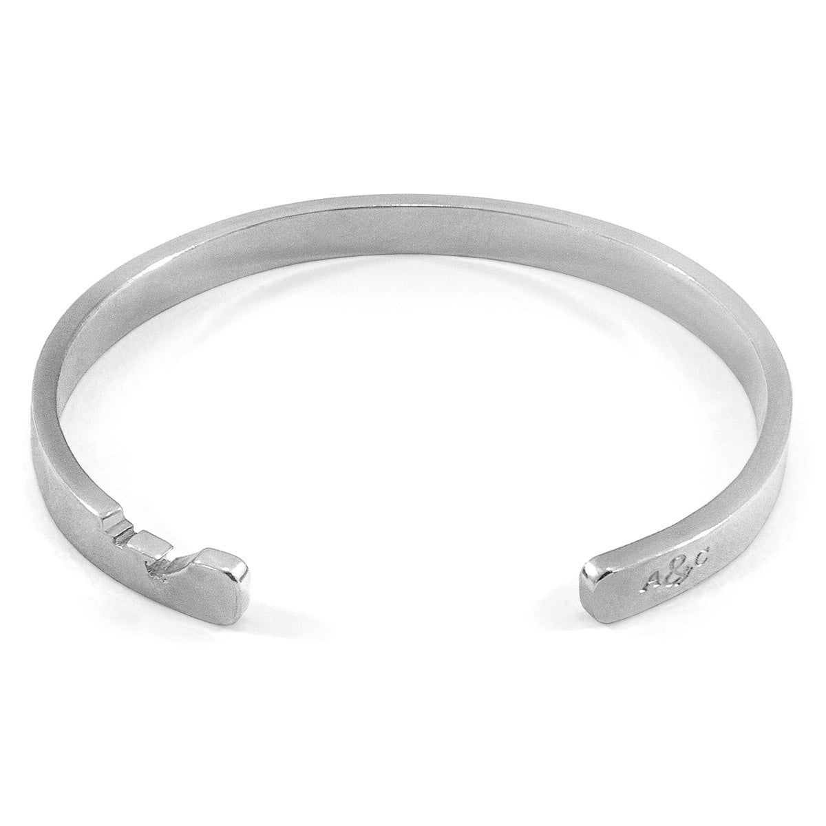 Anchor Cutout Wayfarer Silver Bangle: Handcrafted in Great Britain by ANCHOR & CREW
Keywords: Bangle, Jewelry, Silver

Note: The original title was already descriptive and had relevant keywords, but it was too long and included a Bijou Her