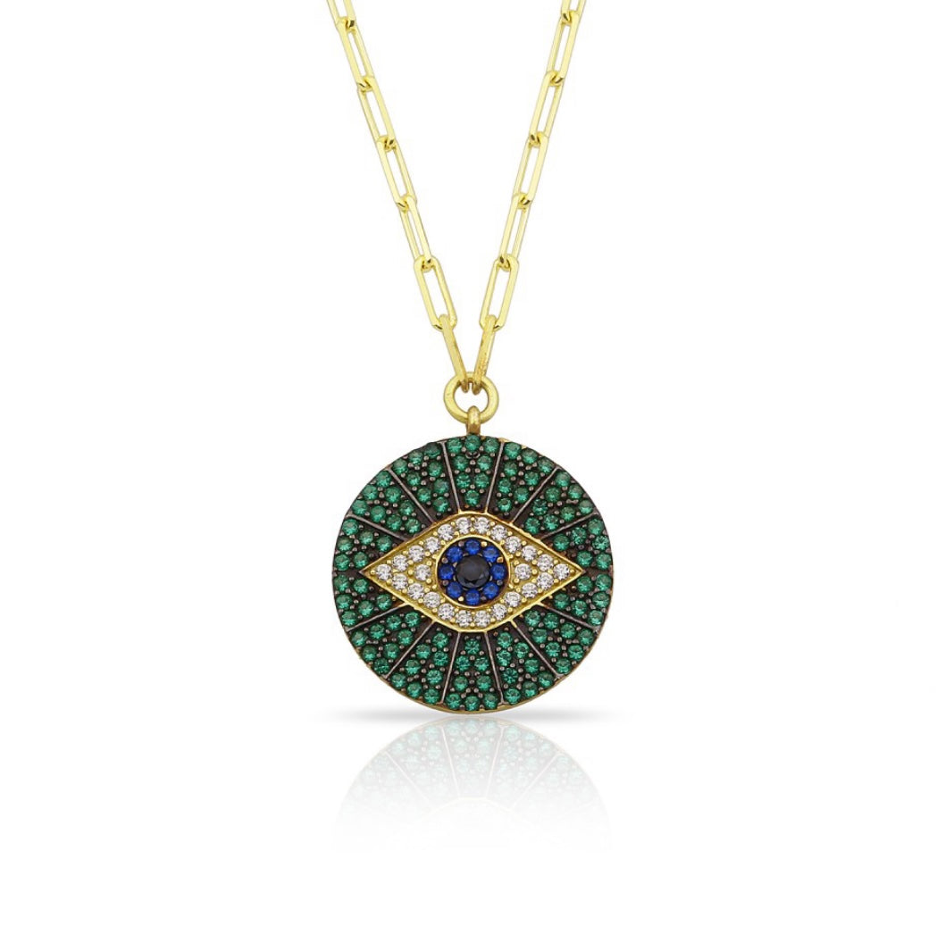 Emerald, Blue & White CZ Evil Eye Necklace - 925 Sterling Silver
Description: Keep negative vibes at bay with this magical medallion pendant featuring sparkling round brilliant cut cubic zirconias in emerald green, royal blue, and bright white. Made of Bijou Her