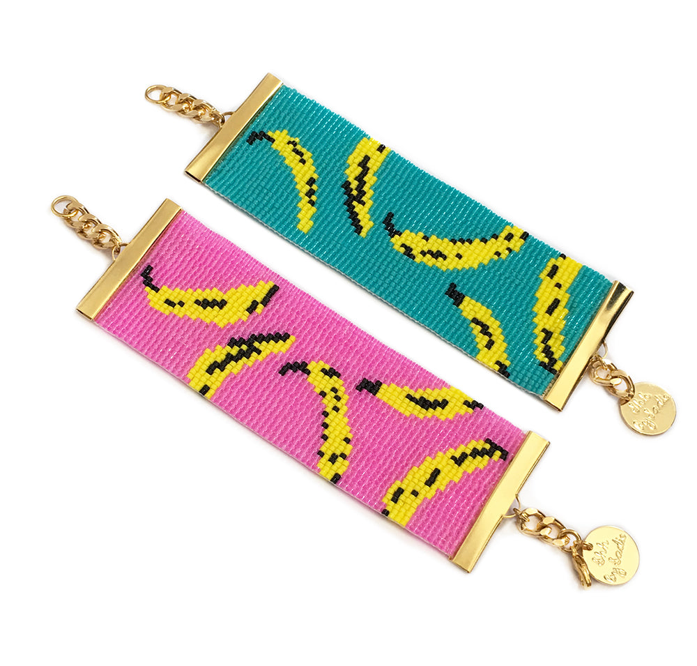 Handmade Bananas Cuff Bracelet - Pink/Turquoise, 24K Gold Plated Chain, 17cm Length
Keywords: Handmade bracelet, bananas print, statement jewellery, summer jewellery, resort wear jewellery, British emerging designer, Welsh designer, - Bracelets - Bijou Her -  -  - 