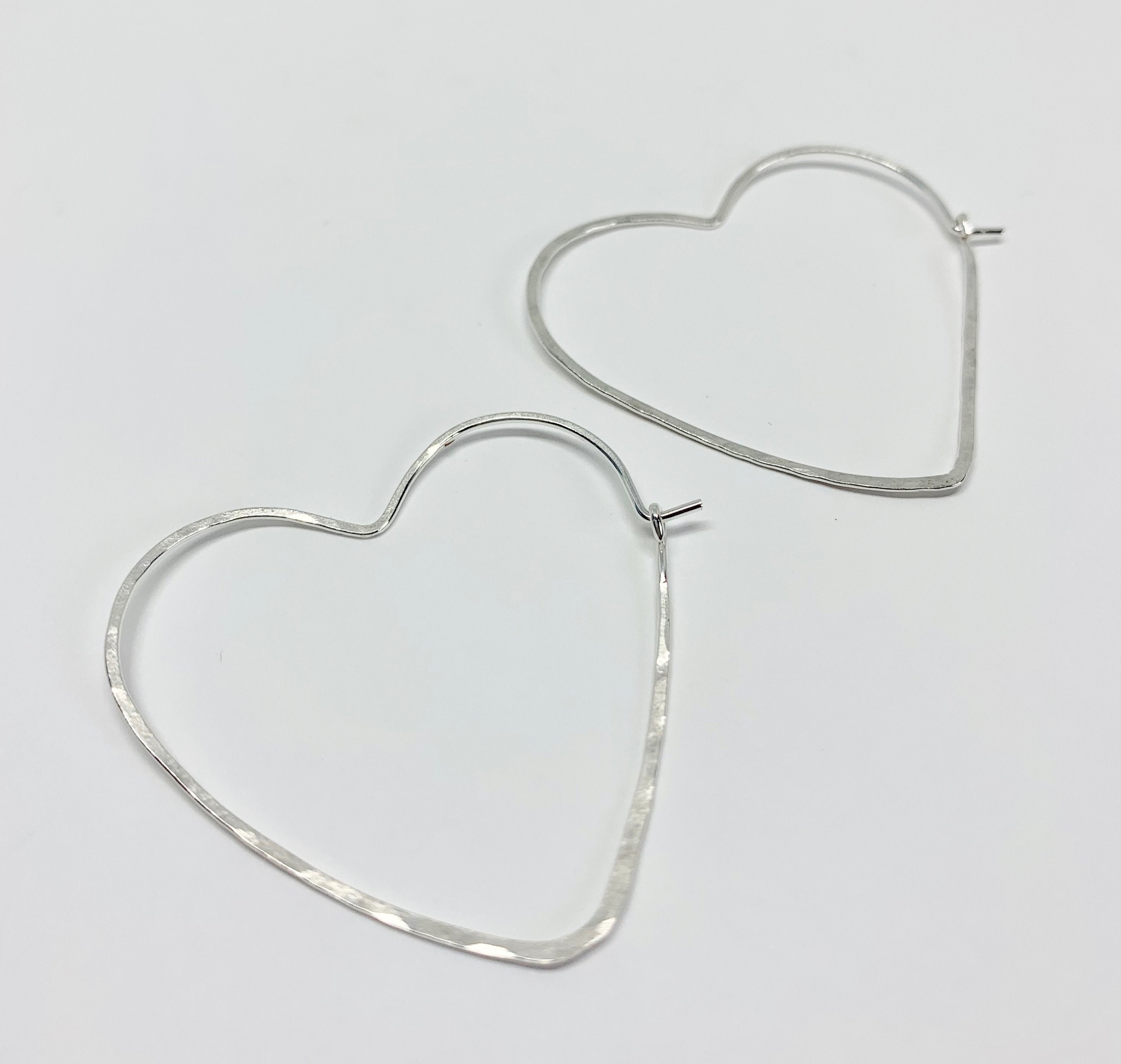 Handmade Heart Hoop Earrings - Elegant and Lightweight Jewelry<p>These classic heart-shaped hoops are hand-formed from 20 gauge wire and feature a hammered texture for added shine. Measuring 1.5" across, they are part of The Spirit Collection and - Jewelry & Watches - Bijou Her -  -  - 